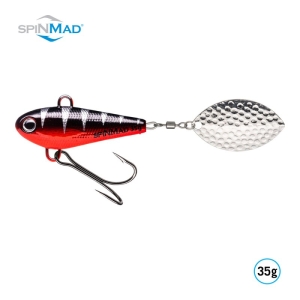 Der Originals Black Perch 35g ist ein Angelköder mit einem rot-schwarz gestreiften Körper, einem Metall-Dreifachhaken und einem silbernen, strukturierten, ovalen Spinnerblatt. Das SPINMAD-Logo befindet sich oben, der Produktname und das Gewicht in der unteren rechten Ecke.