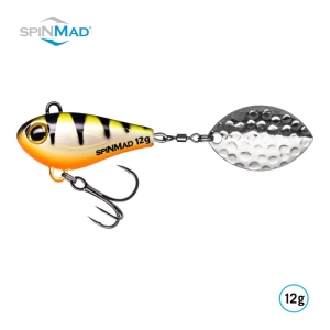 Ein gelb-schwarz gestreifter Angelköder mit einer orangefarbenen Unterseite, einem Spinnerblatt aus Metall und einem Drillingshaken. Der Text "SPINMAD 12g" ist auf den Köder gedruckt. Das SpinMad-Logo befindet sich in der oberen linken Ecke.